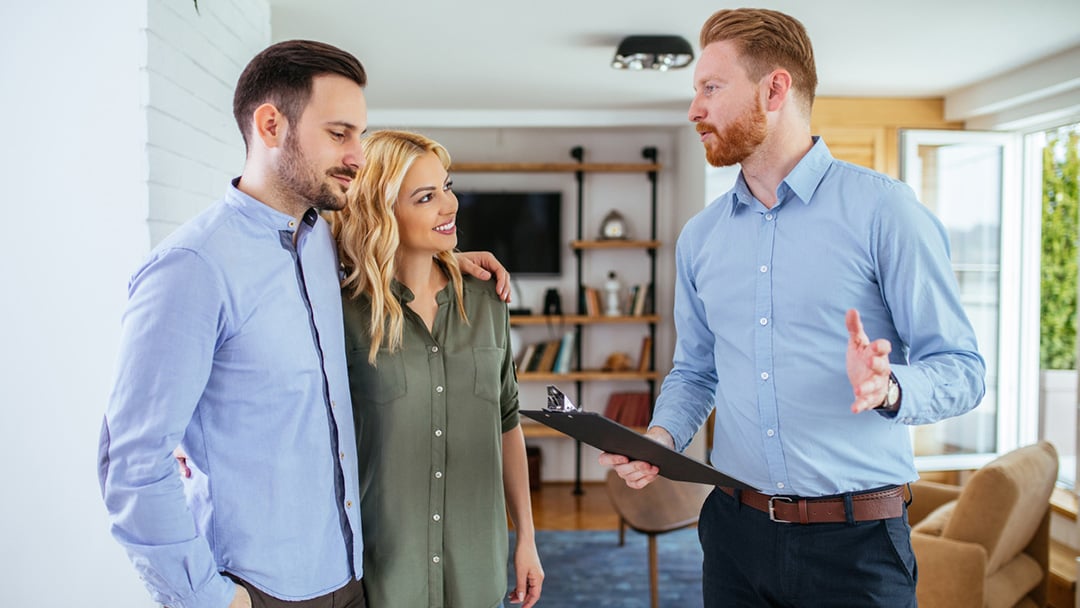 Buyers agent advising clients on their house purchase